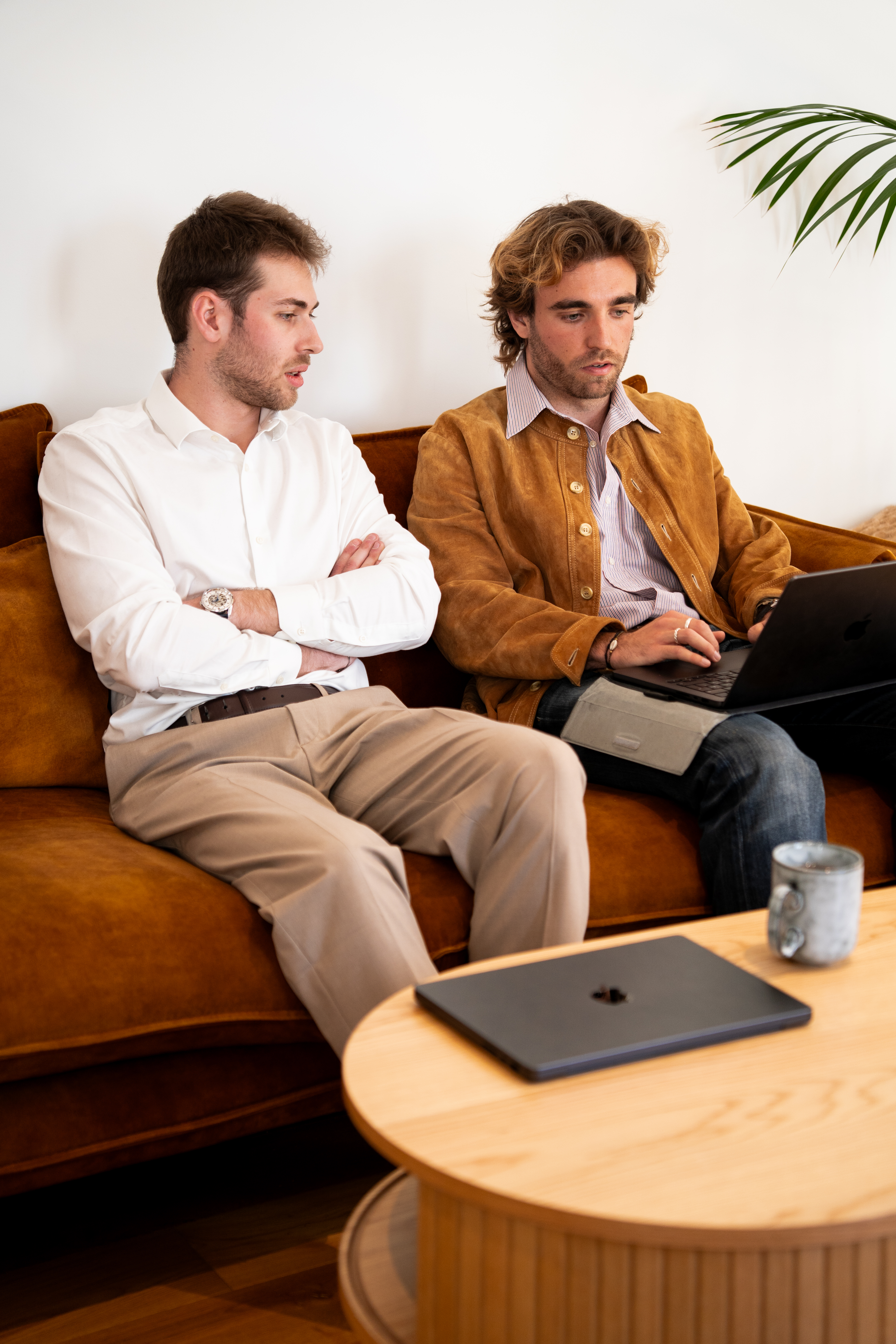 Two Galadrim consultants reviewing around a laptop
